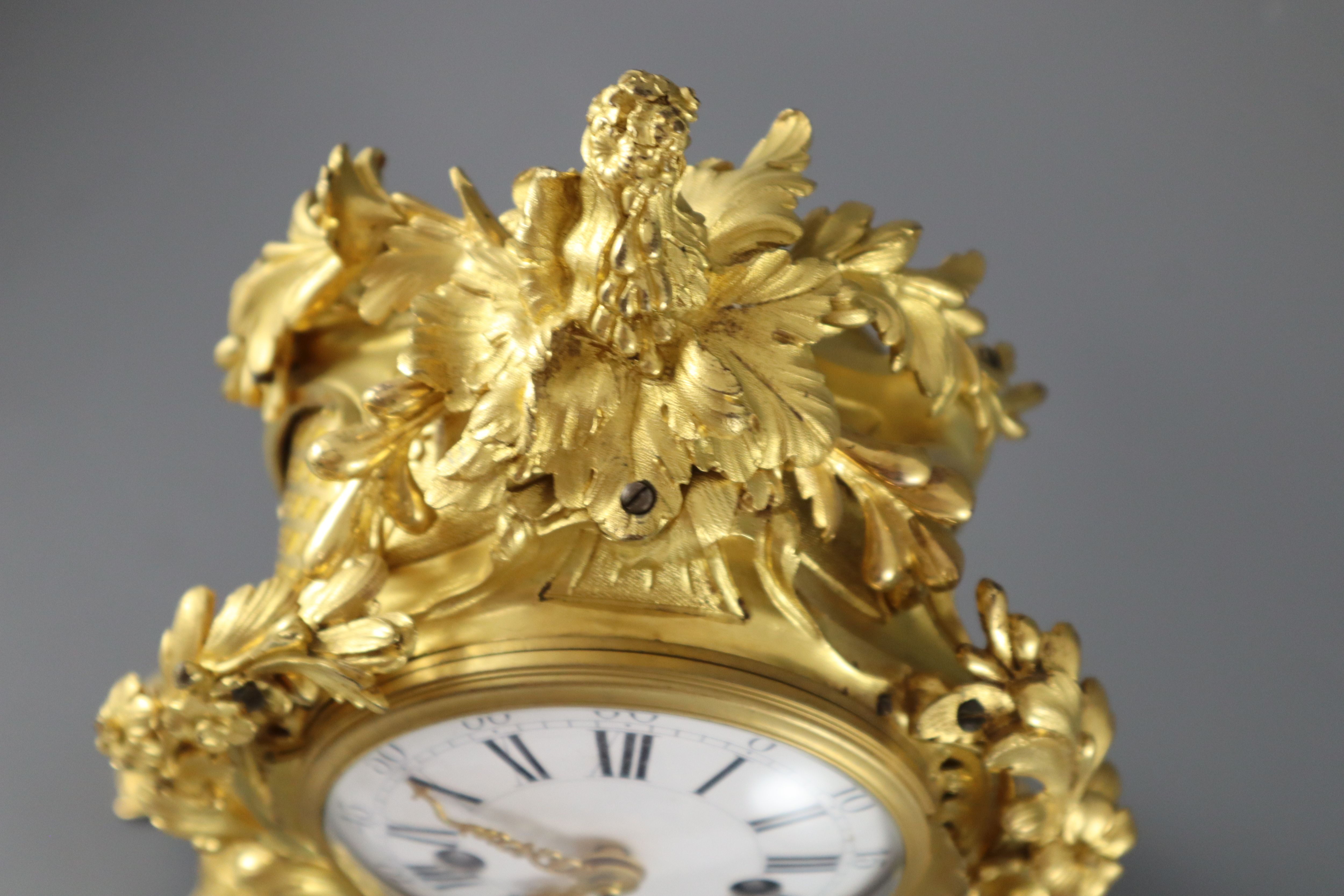 A mid 18th century French ormolu mantel clock, height 15in.